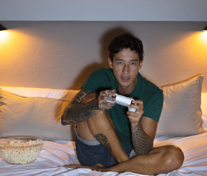 man-playing-video-game-with-his-console man-playing-video-game-with-his-console